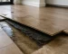 Water damage beneath hybrid flooring