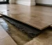 Water damage beneath hybrid flooring